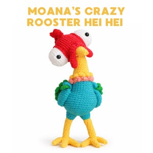 May include: A handmade crochet Hei Hei rooster from the Disney movie Moana. The rooster has a red head, white eyes, a yellow neck, a blue body, and yellow legs. The text "MOANA'S CRAZY ROOSTER HEI HEI" is in yellow letters.
