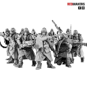 Puede incluir: Un grupo de ocho figuras en miniatura de plástico gris de soldados que llevan cascos y máscaras de gas, sosteniendo armas. Las figuras están dispuestas en formación de batalla.