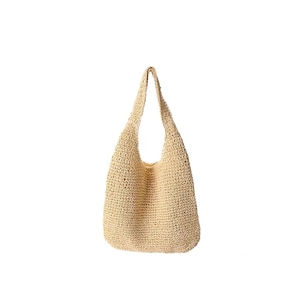 May include: A beige, woven tote bag with a shoulder strap. The bag is made of a natural fibre material and has a large, open interior. The bag is designed with a rounded bottom and a wide opening.