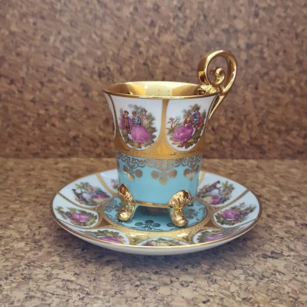 Bavarian Adler JWK Love Story artwork by Fragonard  Demitasse 4 footed Cup and Saucer in Teal, White, Pink and Gold