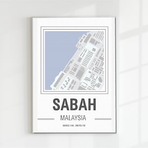 May include: A framed map print of Sabah, Malaysia, featuring a detailed street layout in gray and white against a light blue background. The word "SABAH" is printed in bold, dark gray letters, with "MALAYSIA" below it. Coordinates are at the bottom.