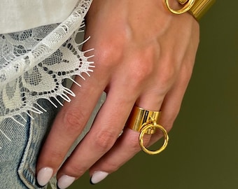 Bold Golden Band Ring with Dangling O Ring Charm: Gold Plated Stainless Steel