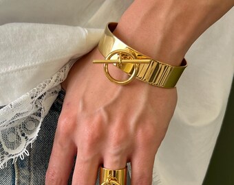 Golden Open Cuff Bracelet with Dangling T-Bar and Ring Charm: Adjustable Gold Plated Stainless Steel Bangle