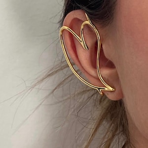 Pendiente contemporáneo de puño envolvente con corazón dorado grande • Puño de oreja con diseño de corazón sin perforación y alambre grueso • Puño moderno grande para oreja exterior derecha ToughCandy
