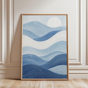 May include: A framed rectangular wall art piece featuring a series of layered, undulating wave patterns in varying shades of blue and white. The design includes a solid white circular sun shape positioned in the upper right corner of the composition.