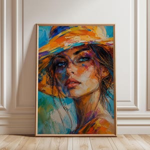Peut inclure: Une peinture à l'huile encadrée représentant le portrait d'une personne portant un chapeau à larges bords. L'œuvre utilise des coups de pinceau épais et vibrants dans des tons orange, jaune, bleu et violet pour illustrer le visage et le chapeau.
