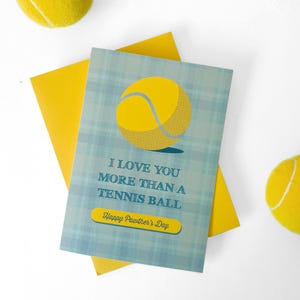 May include: A blue and yellow greeting card with a tennis ball graphic and the text "I love you more than a tennis ball. Happy Pawther's Day."