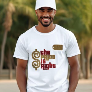 May include: A white short-sleeved t-shirt featuring a large gold glitter dollar sign and the text "the PRICE is Right" in a combination of gold glitter and dark red lettering, along with a small gold glitter rectangular tag graphic.