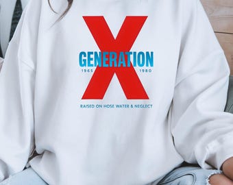 May include: White sweatshirt with a large red "X" graphic and the word "GENERATION" in blue. Below the graphic are the years "1965" and "1980". The text "RAISED ON HOSE WATER & NEGLECT" is below the graphic.