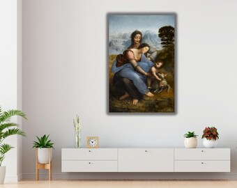 May include: A rectangular wall art print depicting a Renaissance-style painting of two figures and a child with a lamb in a landscape. The scene features muted earth tones, blue drapery, and a distant mountain range under a soft, overcast sky.