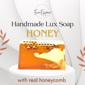 May include: Handmade honey soap bar with real honeycomb. The soap is a light yellow colour with a swirl of darker yellow and a honeycomb pattern.