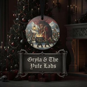 May include: A circular ornament featuring an illustration of Gryla and the Yule Lads around a cauldron, with a black ribbon hanger. Below, a dark grey scroll-shaped plaque displays the text Gryla & The Yule Lads in a gothic font.