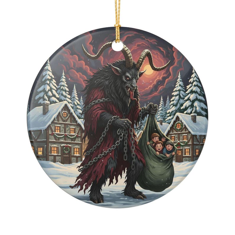 May include: A round ceramic ornament featuring a dark, horned creature with fur and a red robe, holding heavy metal chains and a large sack containing three children. The scene is set in a snowy village with pine trees under a dark, cloudy sky.