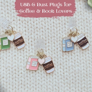 May include: USB-C dust plugs for coffee and book lovers. The image shows three sets of dust plugs. Each set includes a book and a coffee cup charm. The books are green, pink, and blue. The coffee cups are white and brown.