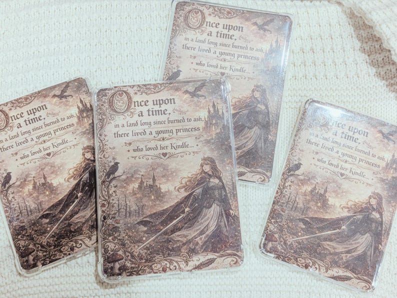 May include: Four rectangular phone cases with a fairytale design. Each case features the text "Once upon a time..." and an illustration of a princess, a castle, and crows in shades of brown and beige.
