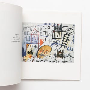 May include: Abstract artwork featuring a mix of shapes and colours on a white backdrop. The painting includes a house, crown, and face, with text in several areas. The artwork measures 127 x 170 cm.