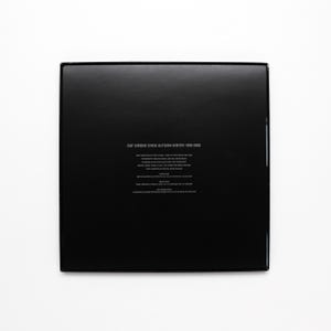May include: Black box with the text "RAF SIMONS SHOW AUTUMN-WINTER 1999-2005" printed on the front. The box contains a book of fashion show photos.