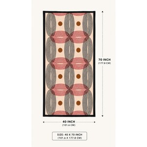May include: A rectangular towel featuring a repeating geometric pattern of interlocking red and black line-art ovals on a cream background with solid brown circles. The towel measures 40 inches by 70 inches, as indicated by the printed text.