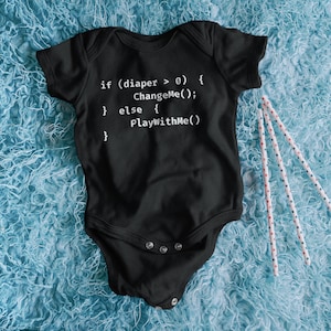 May include: Black baby grow with white text that reads "if (diaper > 0) { ChangeMe(); } else { PlayWithMe()}"