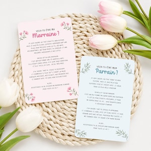 May include: Two cards with floral accents and French text, asking "Will you be my godmother?" and "Will you be my godfather?" The cards are light pink and blue, with decorative floral elements and text.