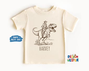 Personalized Dino Cowboy With Custom Name Toddler Shirt, Custom Funny Dinosaur Kids Shirt, Western Cowboy Kids Tee, Family Matching Tee