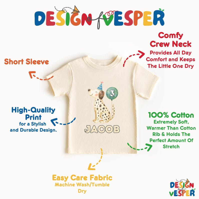 May include: Cream-colored short-sleeved t-shirt with a graphic of a Dalmatian dog wearing a party hat and holding a number 3 balloon. The name "JACOB" is printed below the dog. The shirt is made of 100% cotton.