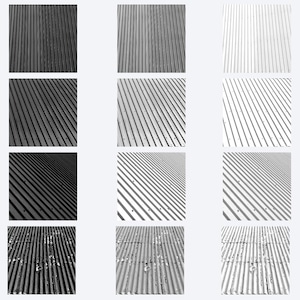 May include: A grid of twelve square panels displaying corrugated metal surfaces in varying shades of black, gray, and white. The panels feature repeating vertical and diagonal lines, with some sections showing textured, weathered, or rusted details.