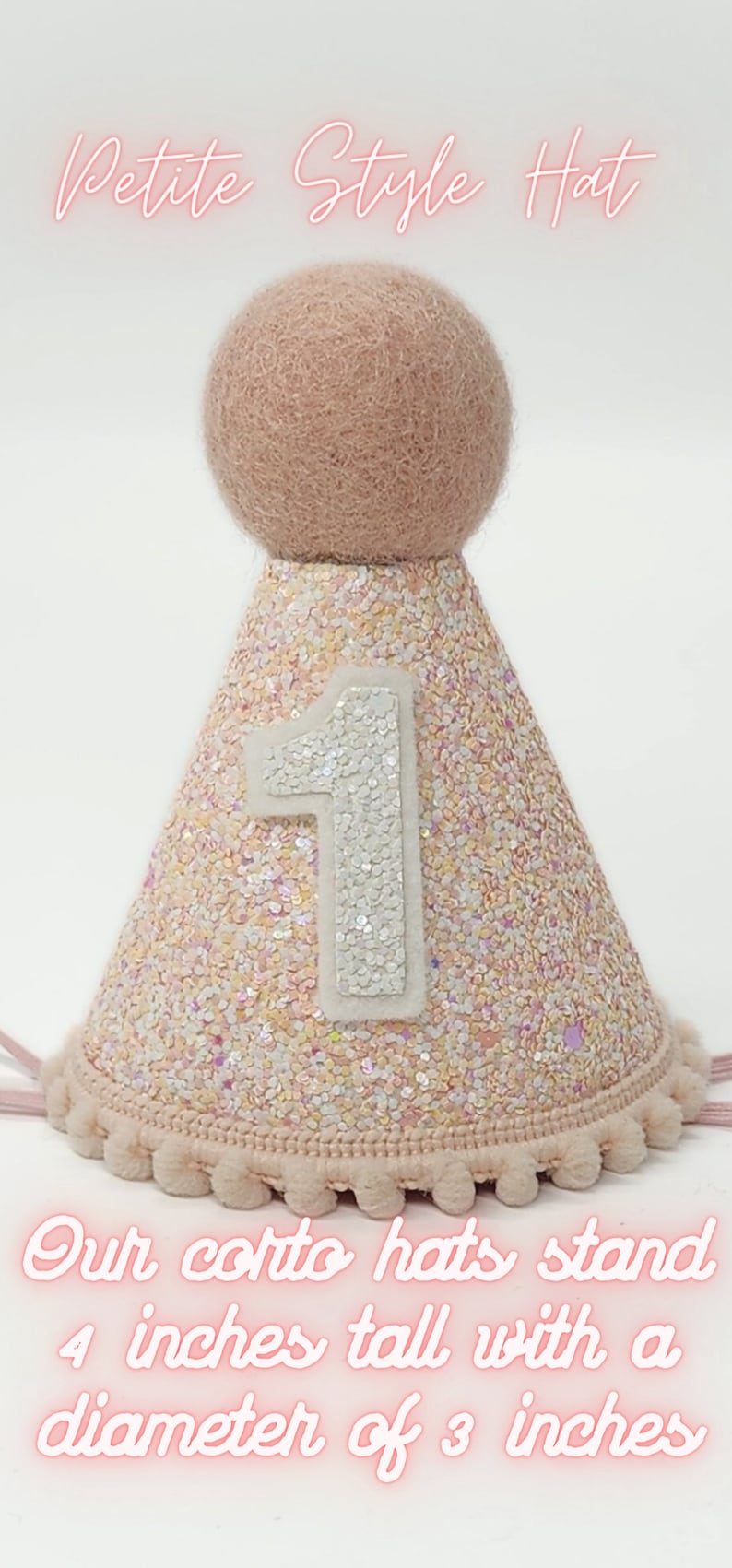 May include: A pink and white glitter party hat with a white felt pom-pom on top and a white felt number "1" on the front. The hat is 4 inches tall with a 3 inch diameter. "Petite Style Hat" is written in pink at the top of the image.