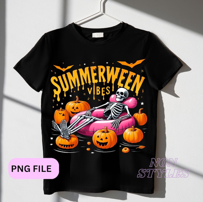 May include: Black t-shirt with a graphic of a skeleton in a pink inflatable pool float surrounded by pumpkins. The text "Summerween Vibes" is above the skeleton.