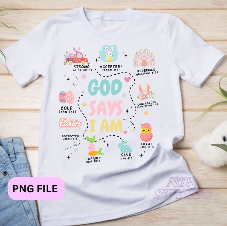 May include: White t-shirt with a colorful Easter design. The design features a heart with the words "God Says I Am" and a circle around it with different Easter-themed illustrations and Bible verses. The verses include Isaiah 40:31, Romans 15:7, Galatians 3:13, John 5:14, Deuteronomy 11:4, 2 Thessalonians 3:3, John 15:13, Mark 10:27, and Luke 6:27.