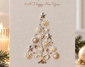 May include: A white greeting card featuring the text Merry Christmas & A Happy New Year and To Alison, Oliver, Willow & Harry. The center displays a Christmas tree design made of silver wire, white pearls, and silver star accents.
