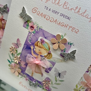 May include: A purple and white birthday card with a fairy illustration and the text "Happy 5th Birthday to a very special Granddaughter Evelyn".