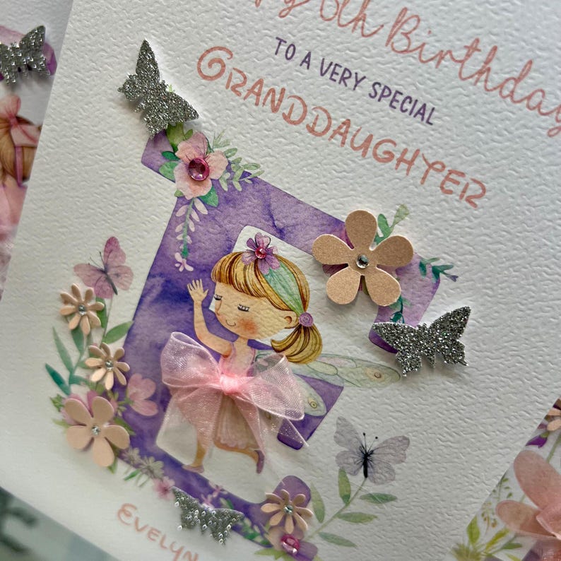 May include: A purple and white birthday card with a fairy illustration and the text "Happy 5th Birthday to a very special Granddaughter Evelyn".