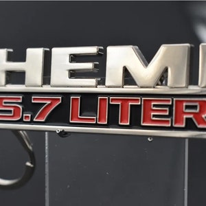 Dodge 5.7L Hemi emblem keychains. Single sided, 3mm thick painted metal keychains. - 7
