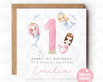 Puede incluir: Una tarjeta de cumpleaños rosa y blanca con una ilustración de acuarela de tres sirenas y el número uno. La tarjeta dice "Feliz 1er cumpleaños a una hija especial Emilia".
