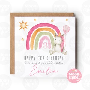 May include: A birthday card featuring a watercolour rainbow, a unicorn holding a balloon, and the number 3. The card reads "Happy 3rd Birthday to a special granddaughter Emilia".