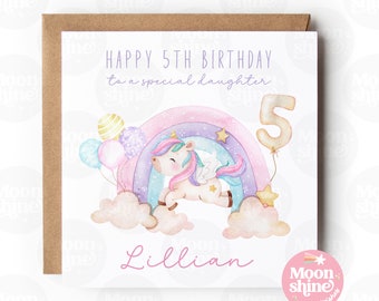 May include: A square birthday card with a watercolor illustration of a unicorn, rainbow, and balloons. The card reads "HAPPY 5TH BIRTHDAY to a special daughter" and includes the name "Lillian". The card is on a kraft paper envelope.