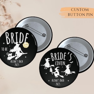 May include: Two black and white button pins with a witch theme. One pin says "Bride to be" with a witch flying on a broomstick and a cat. The other pin says "Bride's Coven" with three witches flying on broomsticks. Both pins have the text "Alisha's Bach 2023".