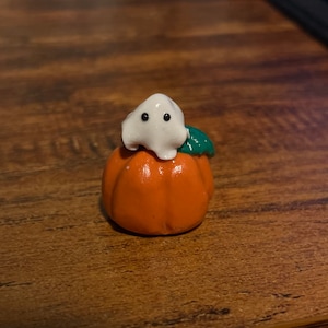 Tiny Ghost on a Pumpkin Figurine