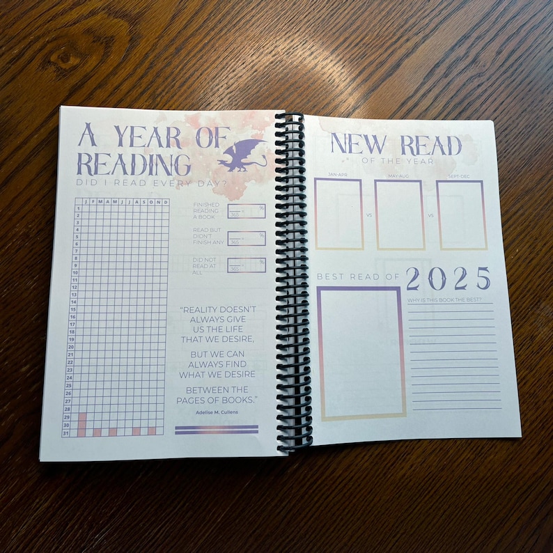 May include: A year of reading journal with a dragon design on the cover. The journal has a grid for tracking daily reading and a section for new reads of the year. The quote "Reality doesn't always give us the life that we desire, but we can always find what we desire between the pages of books." is printed on the page.