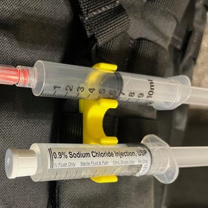 10mL Syringe Snap Holder for flushes, syringes, etc. Great for critical care, nurse, paramedic, nurses. Keychain & MOLLE compatible.