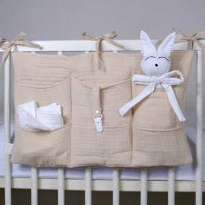 Beige Muslin 6 pocket crib organizer, Wall store for nursery, Baby cot hanging storage for toys, accessories & diapers, bedside diaper caddy