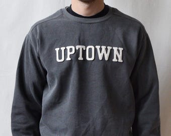 garment-dyed sweatshirt with custom wool patch lettering