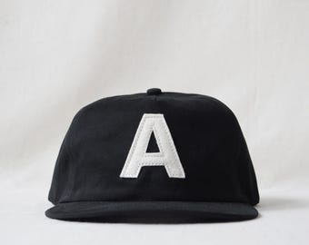 brushed cotton snapback hat with custom wool felt lettering