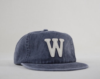 washed cotton field trip hat with custom wool patch lettering