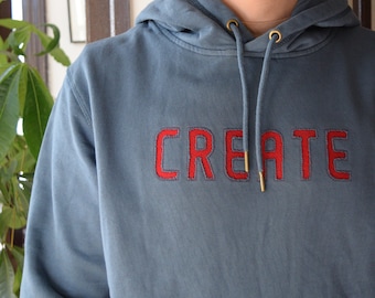 custom organic cotton french terry hooded sweatshirt with 100% wool felt lettering | reverse applique method