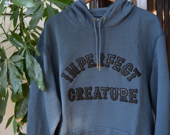 custom organic cotton french terry hooded sweatshirt with hand cut leather lettering