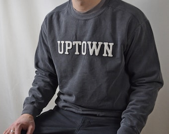 garment-dyed sweatshirt with custom wool patch lettering