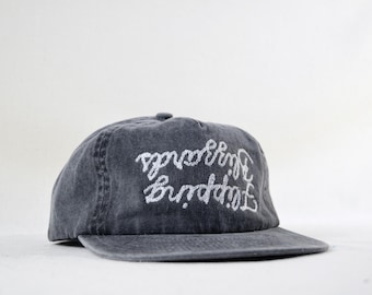 washed cotton field trip hat with custom upside-down chainstitch embroidery