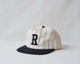 pinstripe field trip hat with custom wool patch lettering